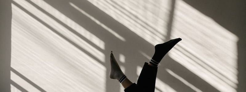 Serene morning light hitting a yoga mat in studio.