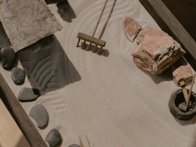 Zen garden elements representing balance and harmony in yoga.